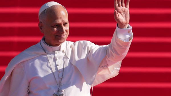 Pope Leo XIV waves as he leaves the Almudena Cathedral after leading prayer and devotion to Our Lady of Almudena in Madrid