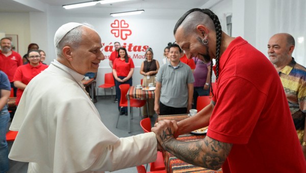 Pope Leo XIV shaking hands with a volunteers during his visit to Caritas charity's centre for homeless people ìCedia 24 horasî in Lucero neighbourhood in Madrid, on June 6, 2026