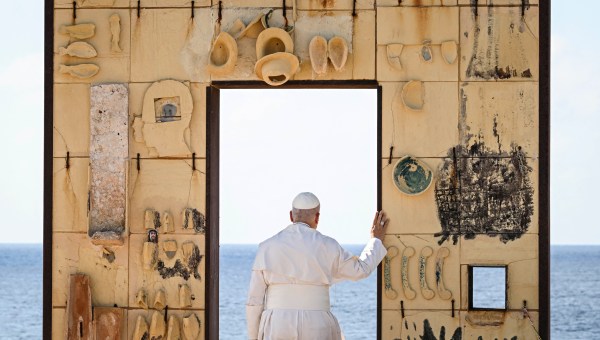 Pope Leo XIV walks trough the arch of the monument Door of Europe - Porta d'Europa made by the italian artist Mimmo Paladino, during a one day visit to Lampedusa island, south of Sicily, on July 4, 2026.