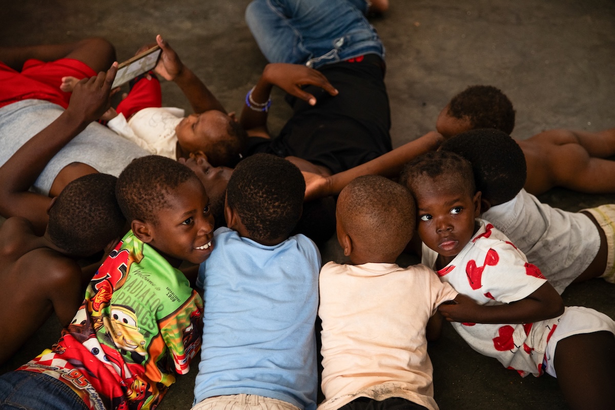 Children in a Port-au-Prince displacement camp, July 31, 2026, as TPS termination raises deportation fears